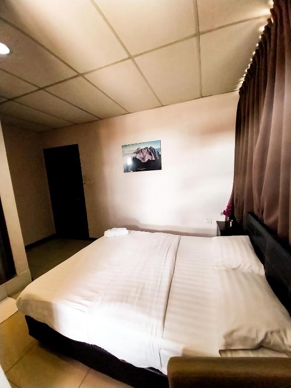 Postel nebo postele na pokoji v ubytování MB Budget Hotel