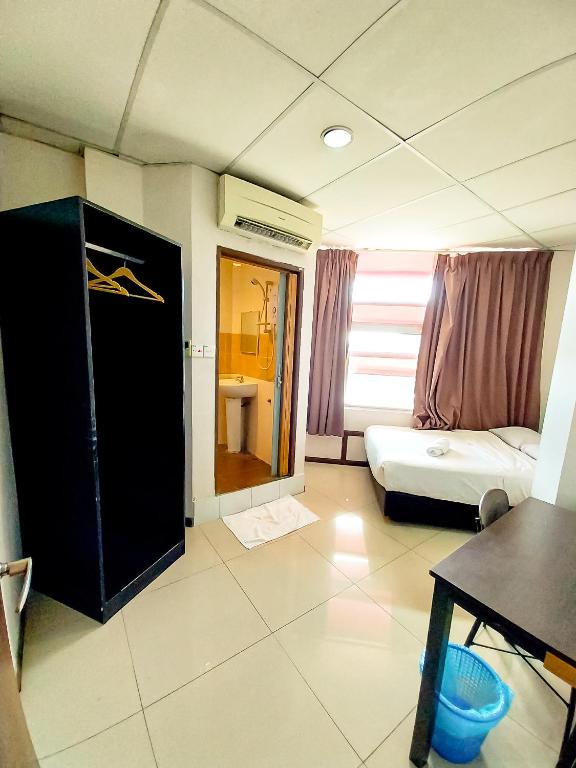 Postel nebo postele na pokoji v ubytování MB Budget Hotel
