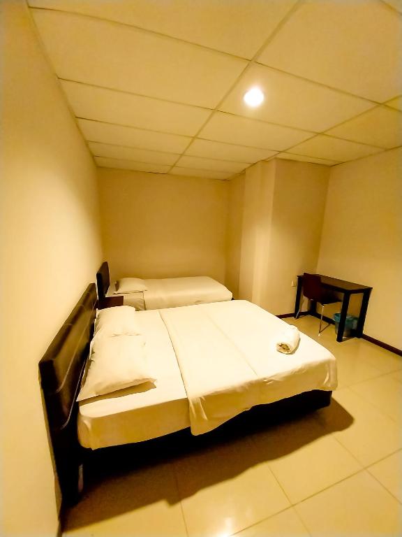 Postel nebo postele na pokoji v ubytování MB Budget Hotel