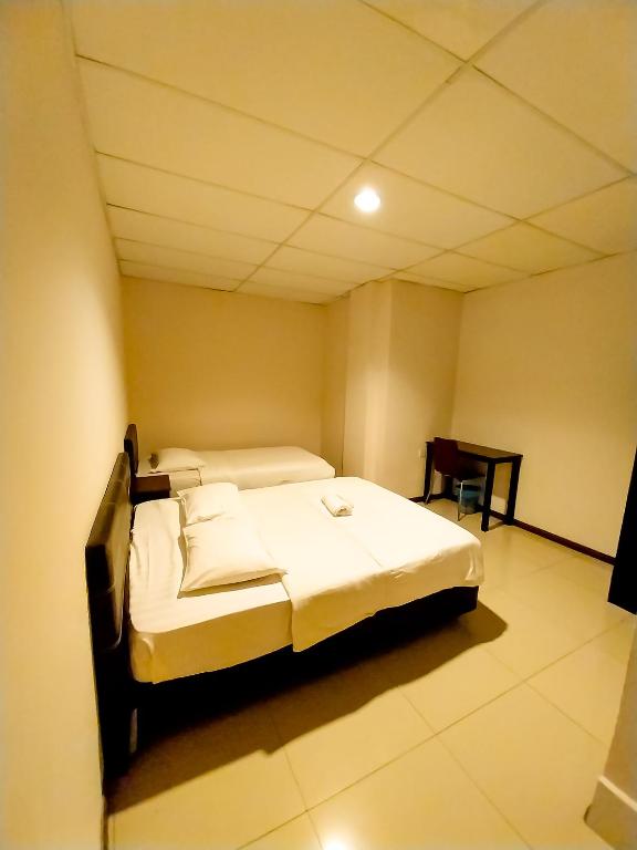 Postel nebo postele na pokoji v ubytování MB Budget Hotel