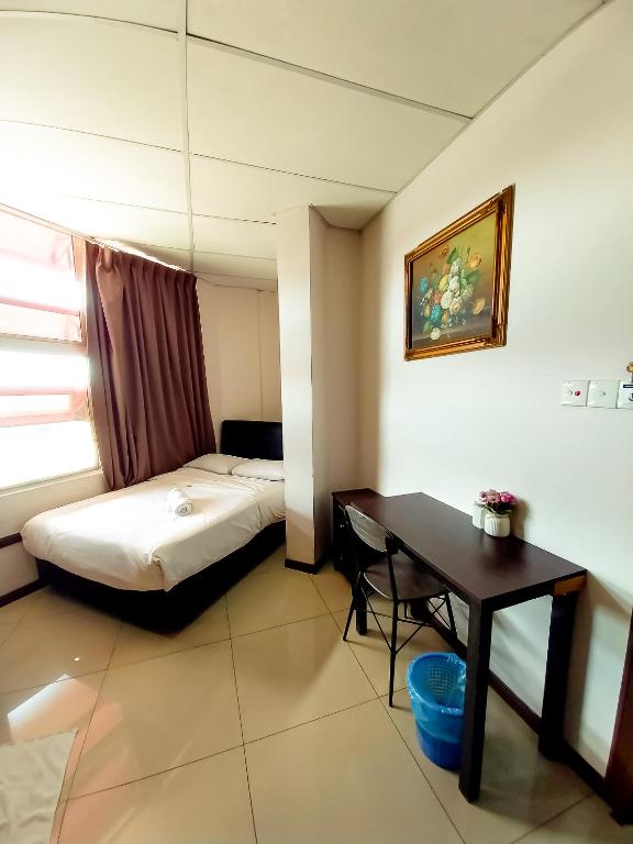 Postel nebo postele na pokoji v ubytování MB Budget Hotel