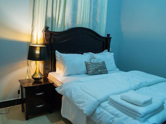 Un pat sau paturi într-o cameră la Haven Homes