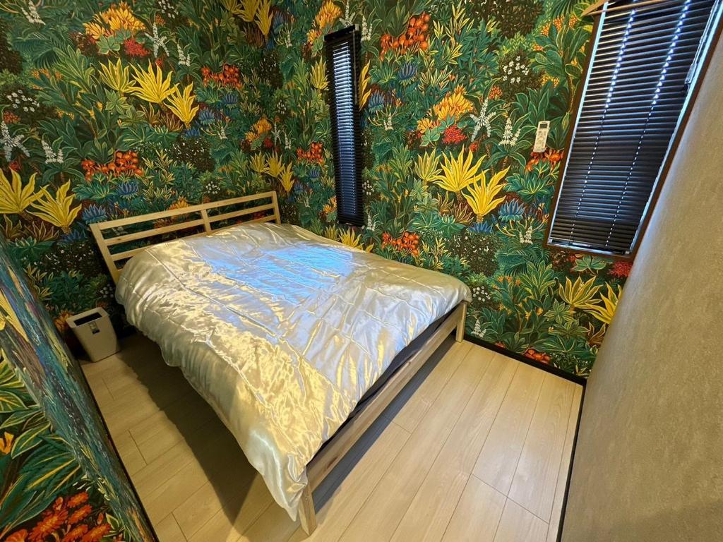 Postel nebo postele na pokoji v ubytování The No.10 Sunrise Beach 九十九里