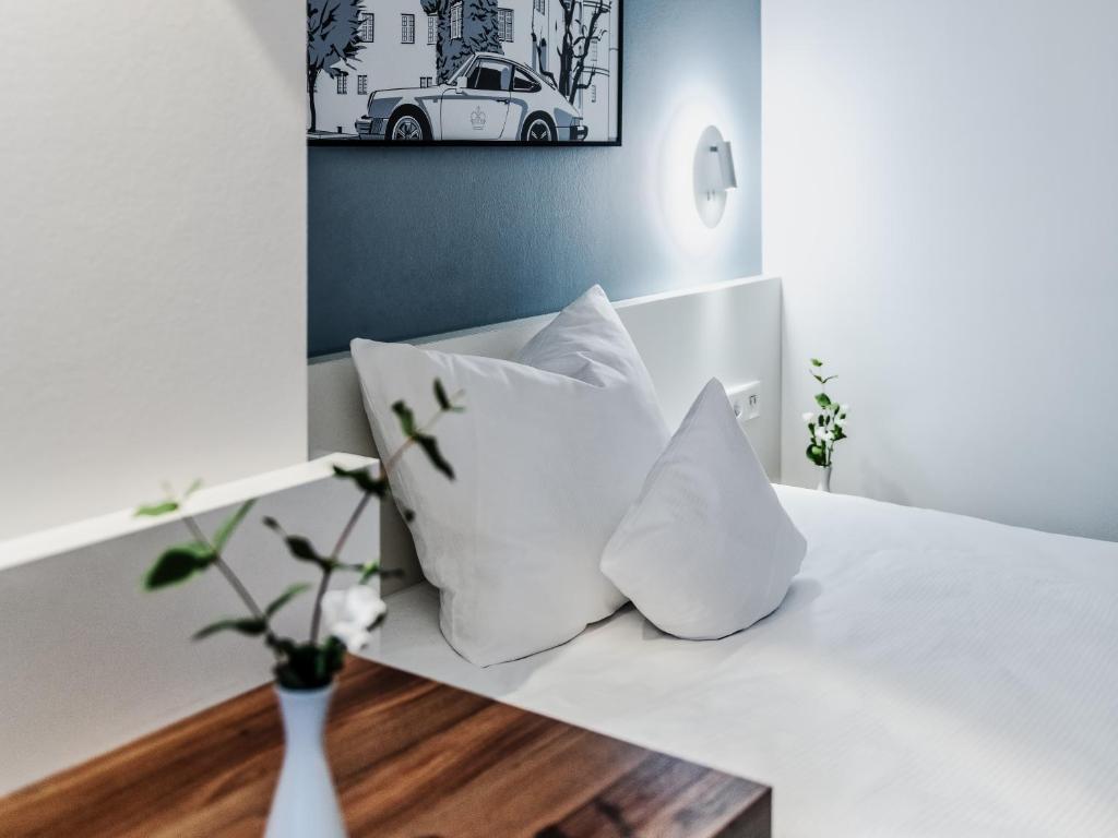 Postel nebo postele na pokoji v ubytování Hotel Royal