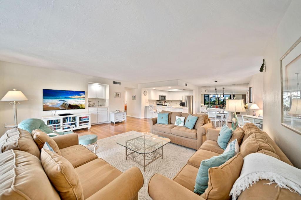 a living room with a couch and a table at Compass Pointe #201 in Sanibel