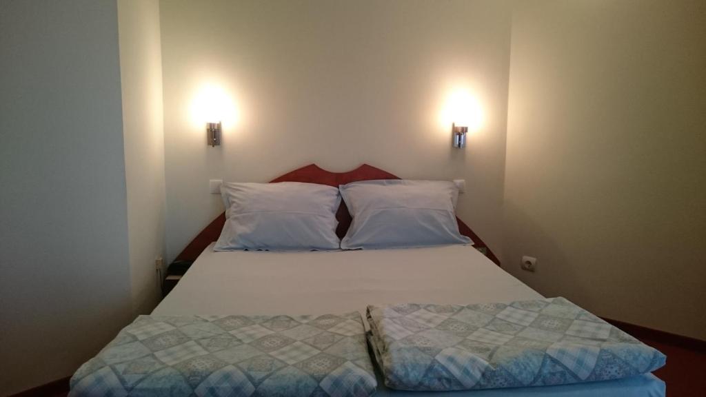 Postel nebo postele na pokoji v ubytování Classic Hotel