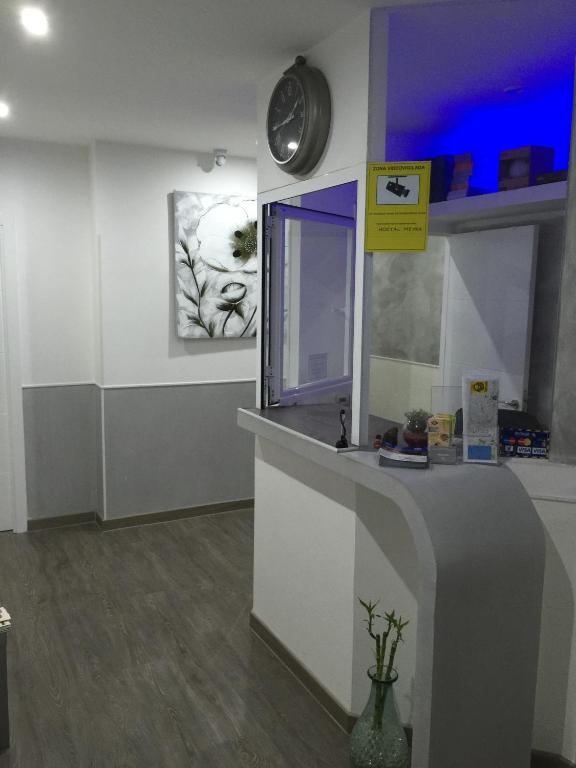 A kitchen or kitchenette at Hostal Meyra