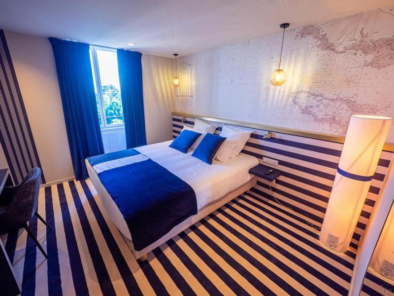 Postel nebo postele na pokoji v ubytování HOTEL LA MARINE