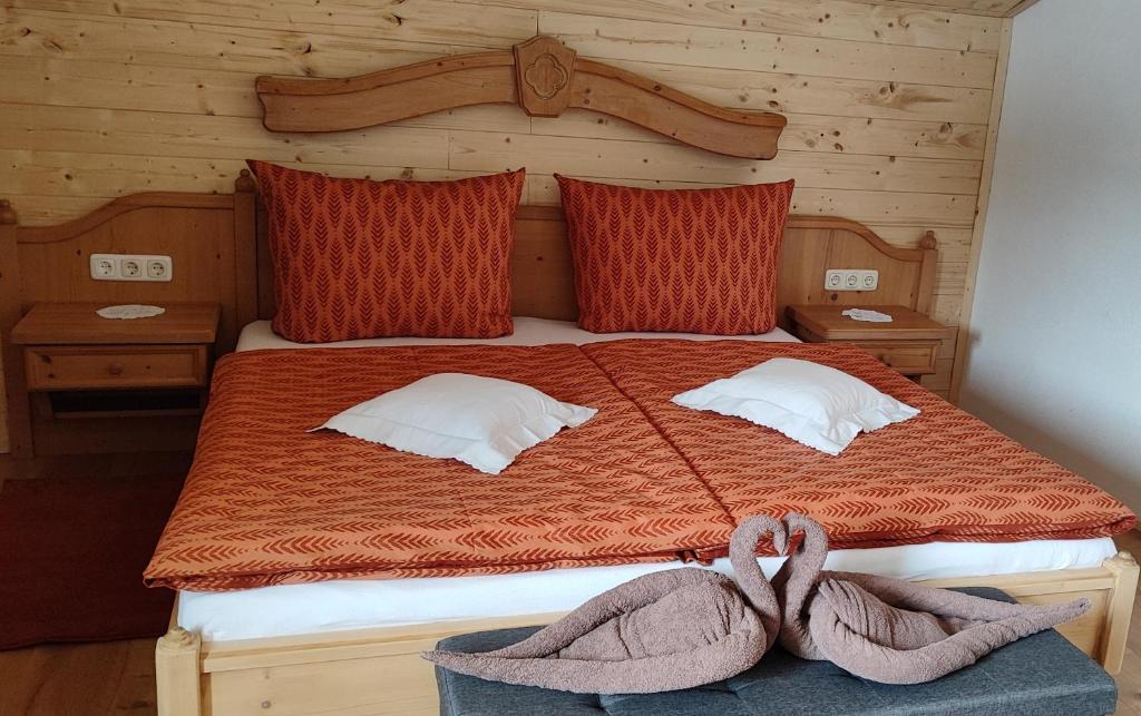 a bedroom with a bed with two towels on it at Ferienhaus Lechtaler Alpen in Bach