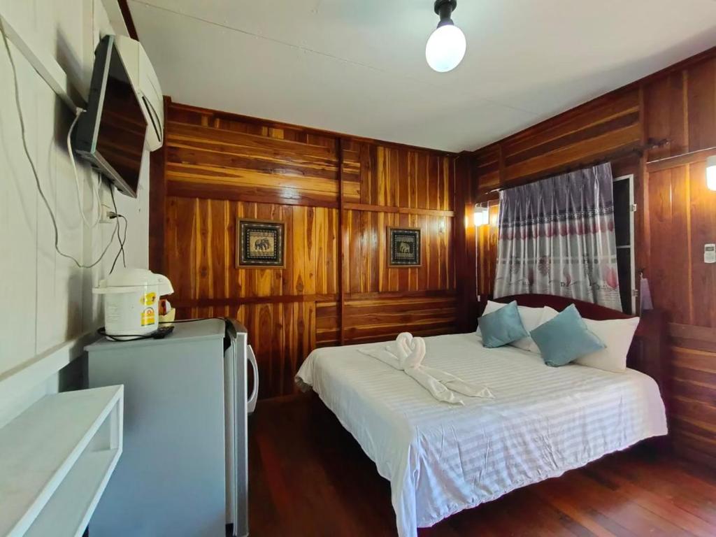 Postel nebo postele na pokoji v ubytování Pai Tewdoi ปาย ทิวดอย รีสอร์ท