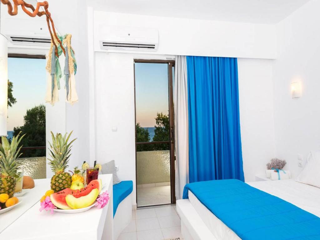 Postel nebo postele na pokoji v ubytování Mojito Beach Rooms