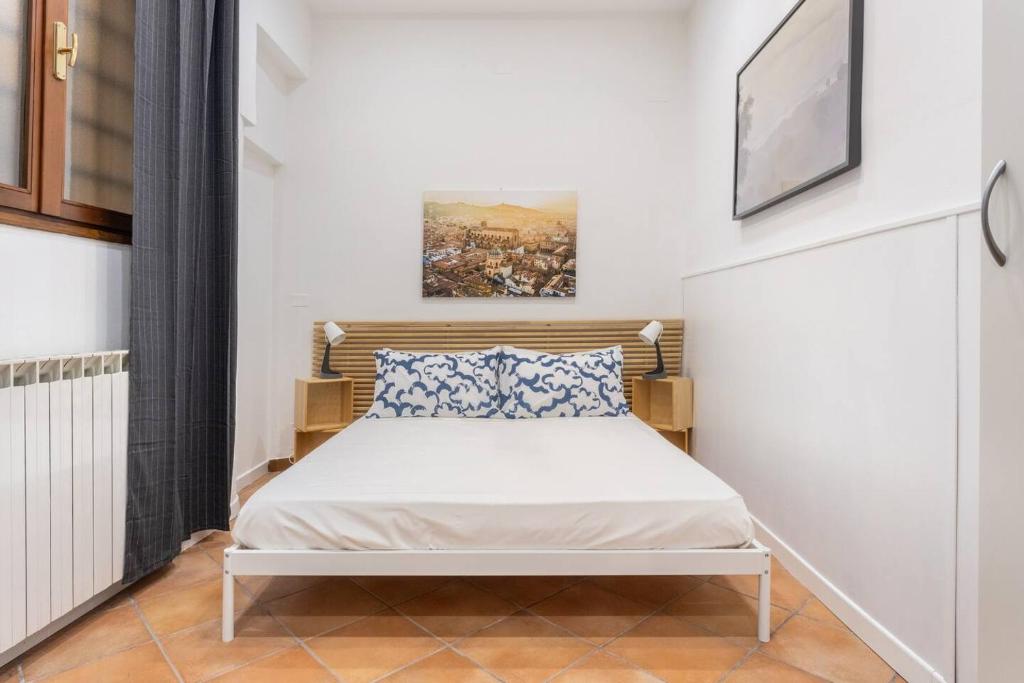 Postel nebo postele na pokoji v ubytování Dimora degli Archeologi