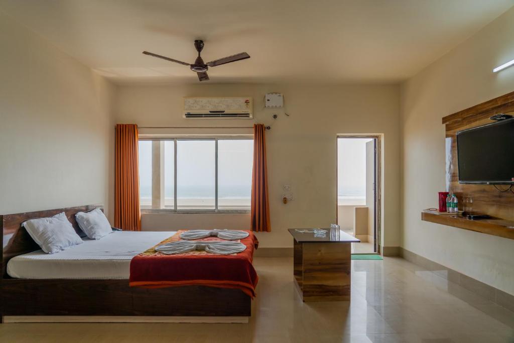 Postel nebo postele na pokoji v ubytování Hotel Nilkantha