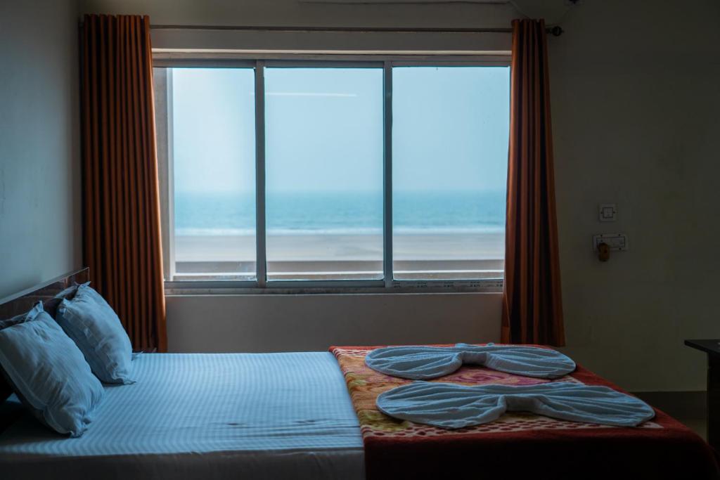 Postel nebo postele na pokoji v ubytování Hotel Nilkantha