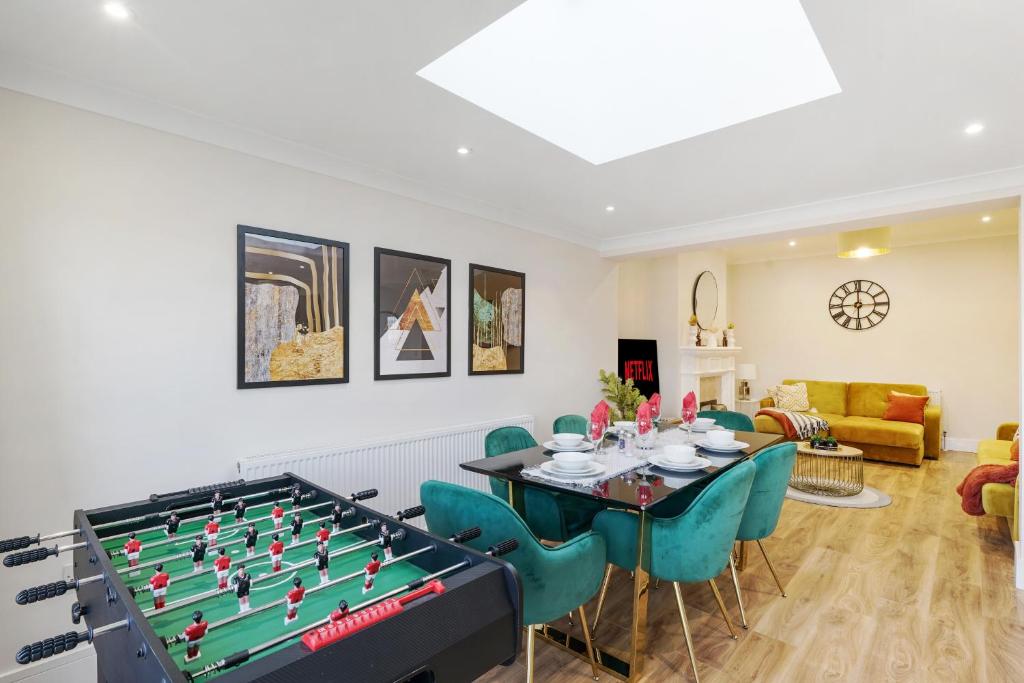 a living room with a large pool table at Spacious house in Wembley - Garden in London
