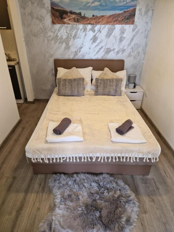 Postel nebo postele na pokoji v ubytování Apartments Vukman