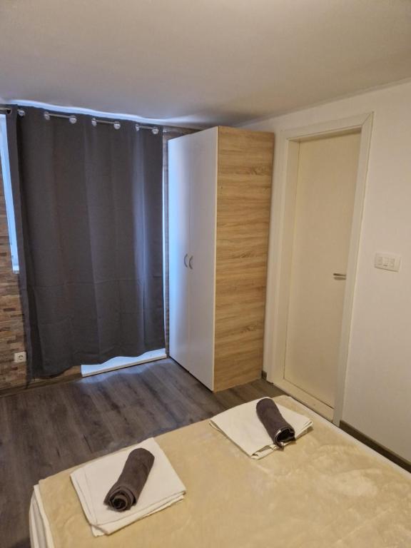 Postel nebo postele na pokoji v ubytování Apartments Vukman