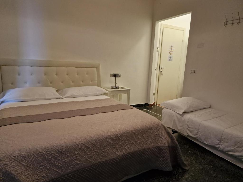 Postel nebo postele na pokoji v ubytování Le logge