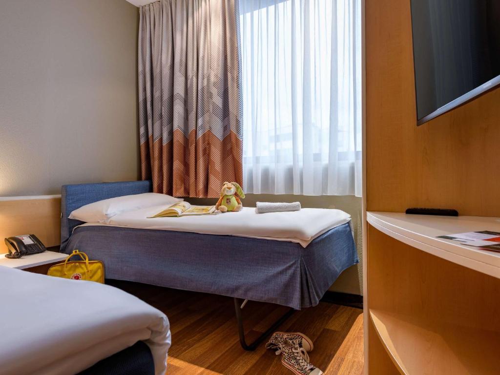 Postel nebo postele na pokoji v ubytování ibis Heilbronn City