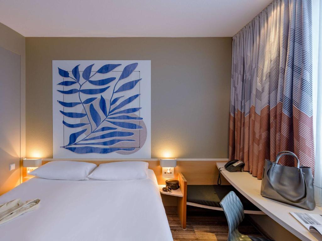 Postel nebo postele na pokoji v ubytování ibis Heilbronn City