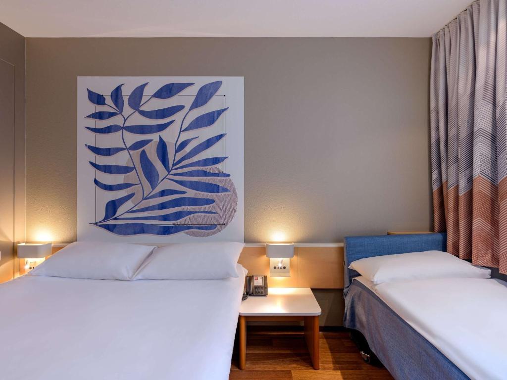 Postel nebo postele na pokoji v ubytování ibis Heilbronn City