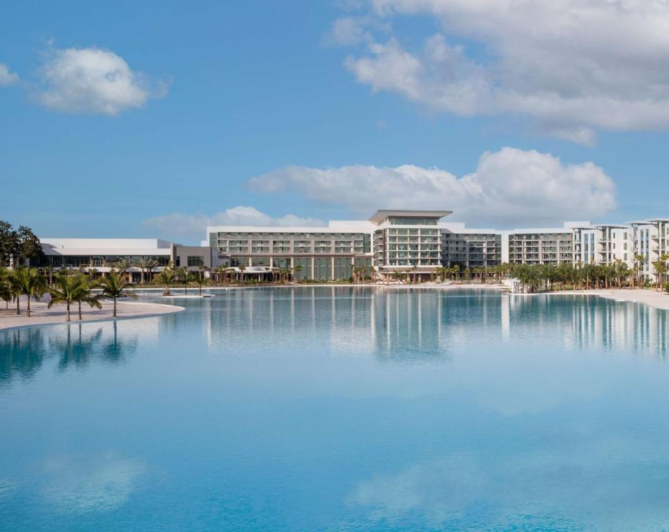 a large pool of water in front of a building at Conrad Orlando in Orlando