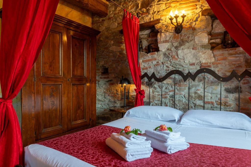 Postel nebo postele na pokoji v ubytování Castello dei Templari