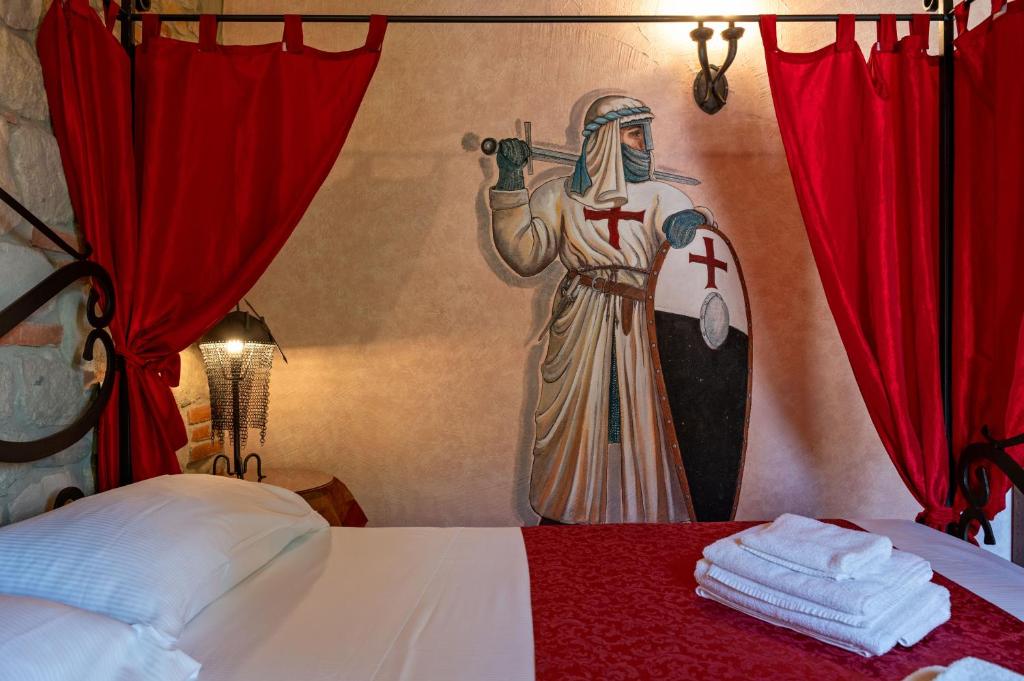 Postel nebo postele na pokoji v ubytování Castello dei Templari