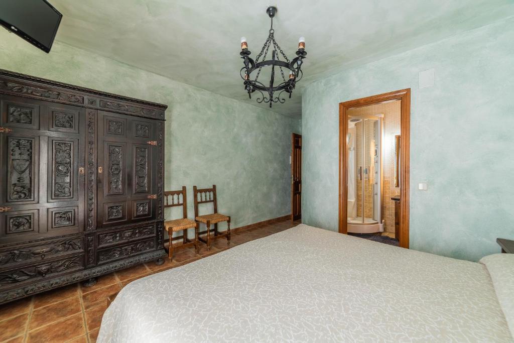 Posteľ alebo postele v izbe v ubytovaní Casa Rural Castillo Diempures