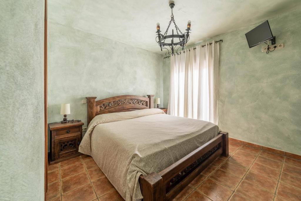 Posteľ alebo postele v izbe v ubytovaní Casa Rural Castillo Diempures