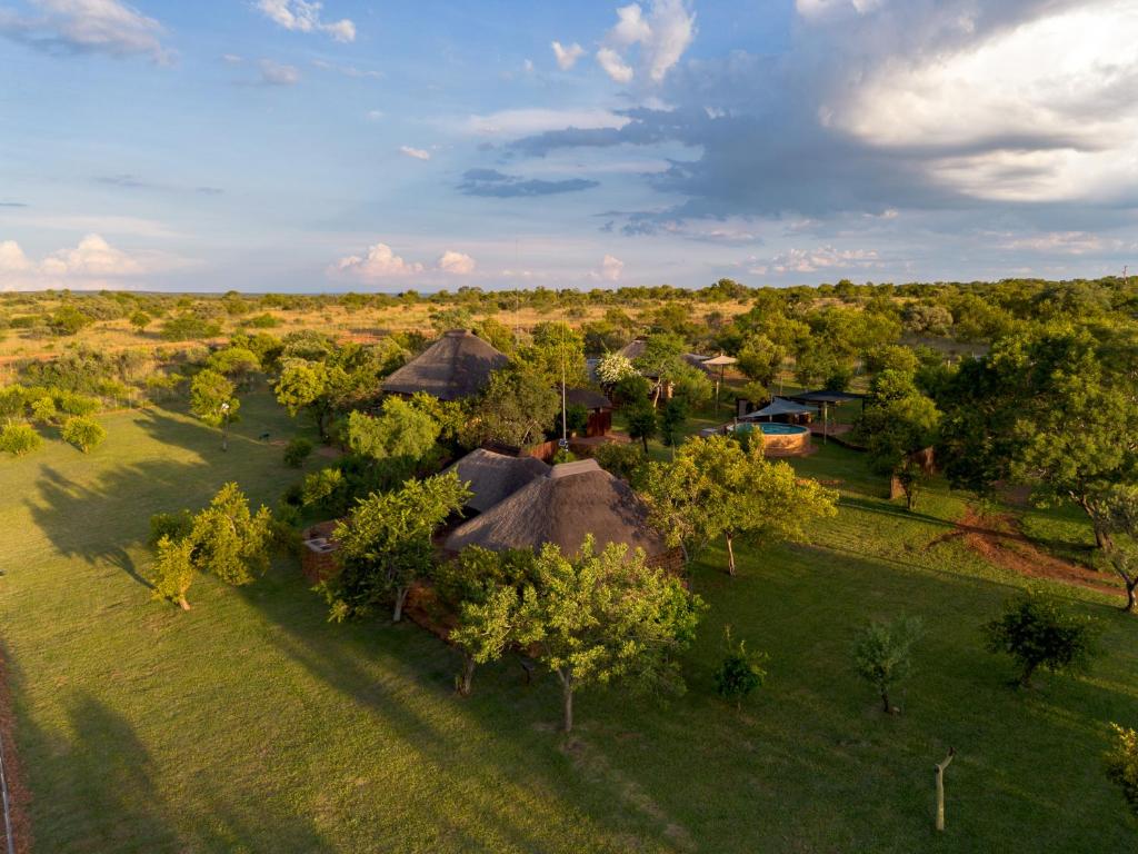 an overhead view of a group of huts in a field at Klipdrift Sands Bush Camp in Dinokeng Game Reserve