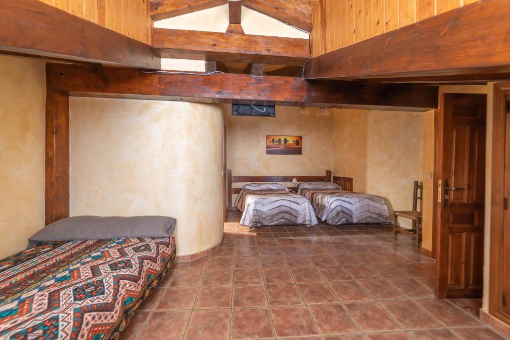 Posteľ alebo postele v izbe v ubytovaní Casa Rural Castillo Diempures