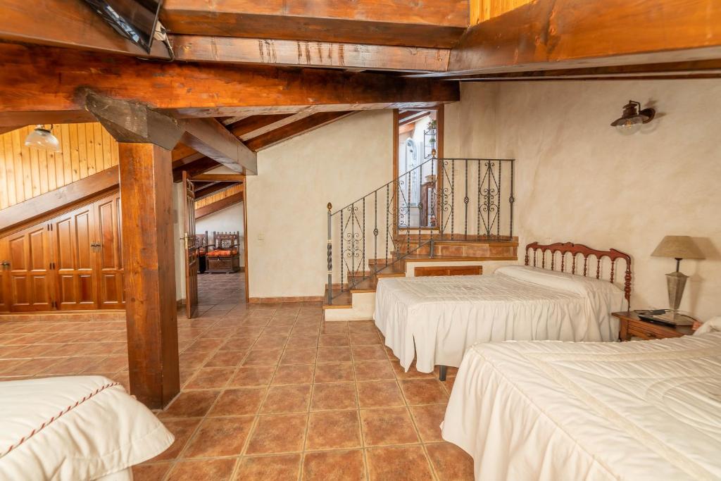 Posteľ alebo postele v izbe v ubytovaní Casa Rural Castillo Diempures