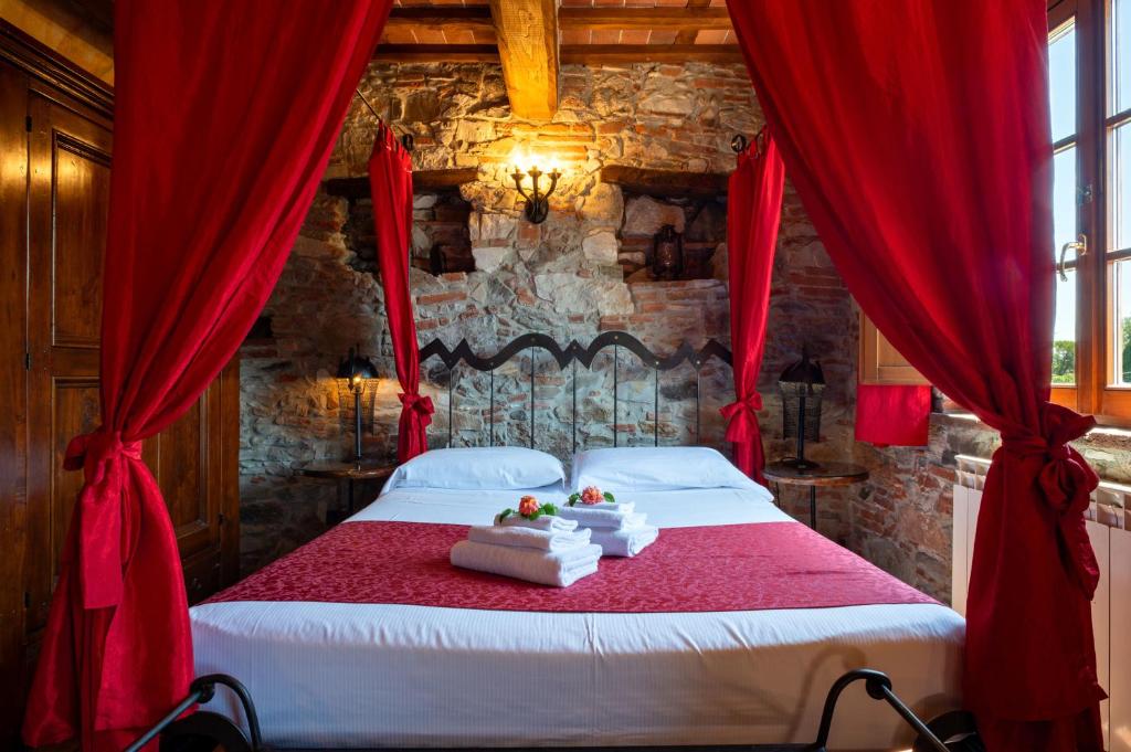 Postel nebo postele na pokoji v ubytování Castello dei Templari