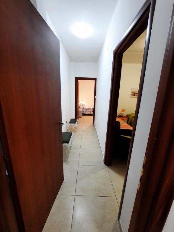 a hallway with a door and a living room at B&B Costa Gentile in Taranto