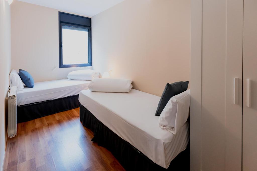 Postel nebo postele na pokoji v ubytování Pierre & Vacances La Merceria