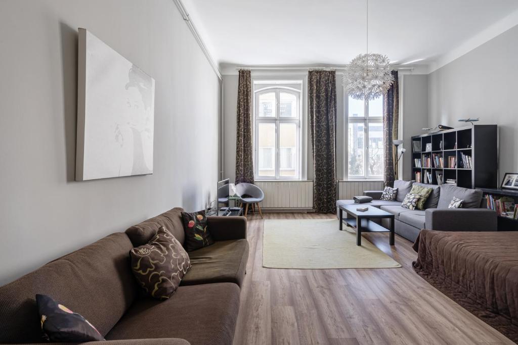 a living room with a couch and a table at BpR Castle Hill Apartment with Garden in Budapest