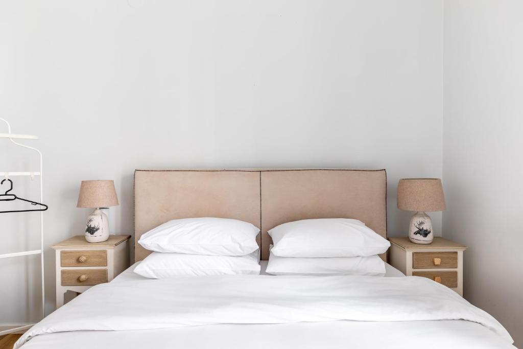 A bed or beds in a room at Eclair by halu! Apartments