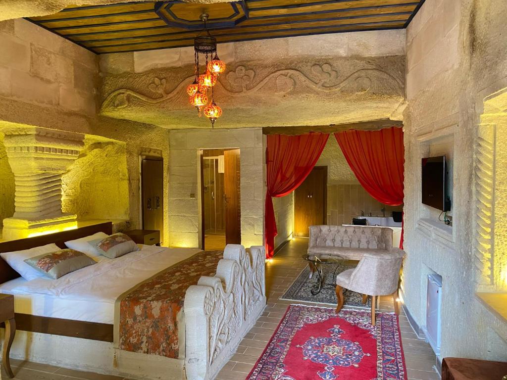 Postel nebo postele na pokoji v ubytování Mesken Cave Suites