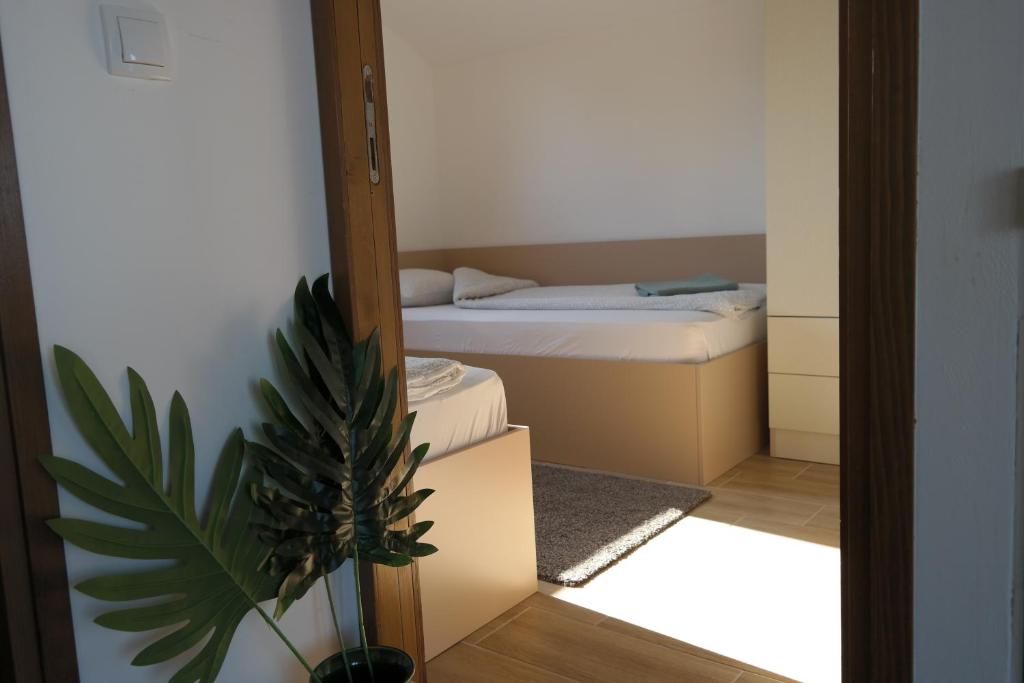 Postel nebo postele na pokoji v ubytování LIPA houses & spa