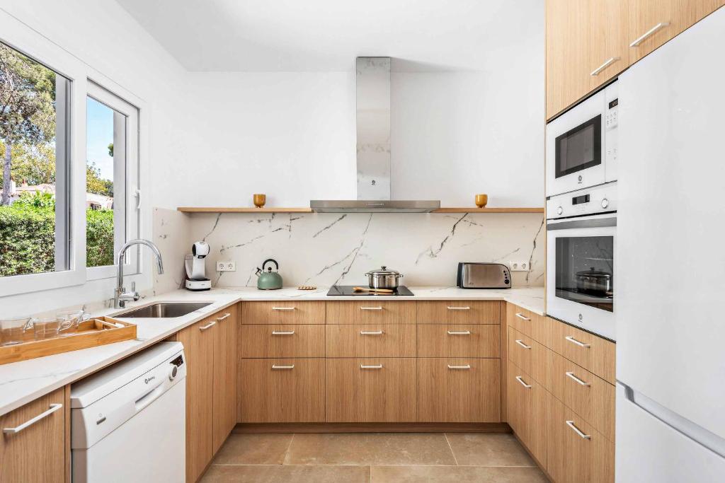 Kuchyň nebo kuchyňský kout v ubytování Villa Gabriela