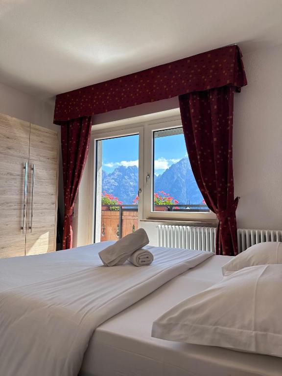 Postel nebo postele na pokoji v ubytování Hotel Tre Pini