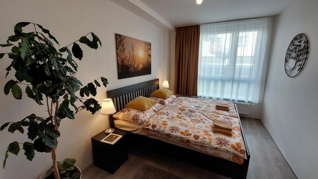 Postel nebo postele na pokoji v ubytování Apartmán Trilobit