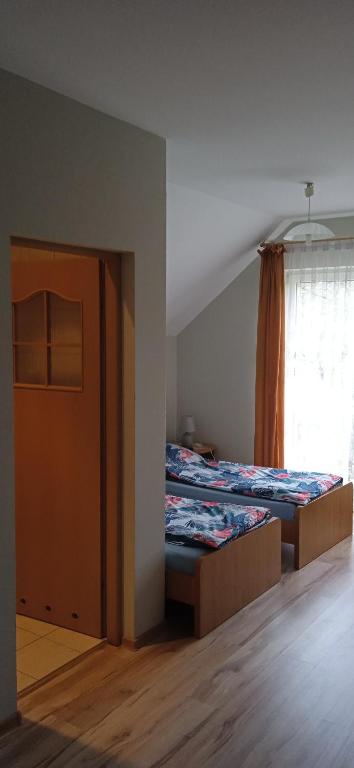 Postel nebo postele na pokoji v ubytování Kaszubskie Nuty