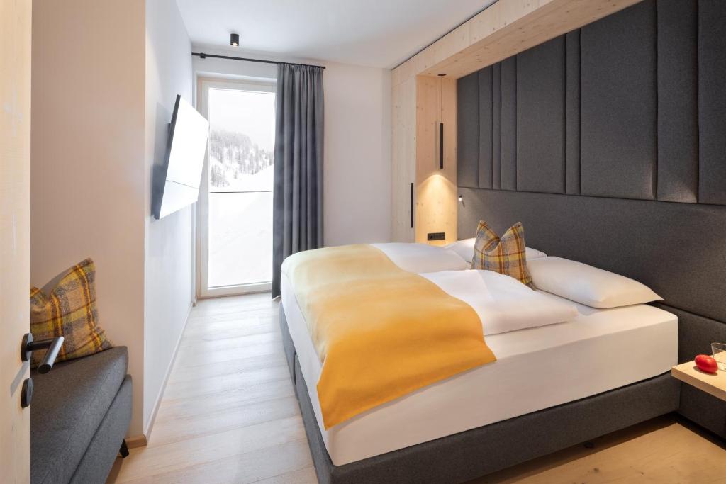 Posteľ alebo postele v izbe v ubytovaní Apparthotel Sonne