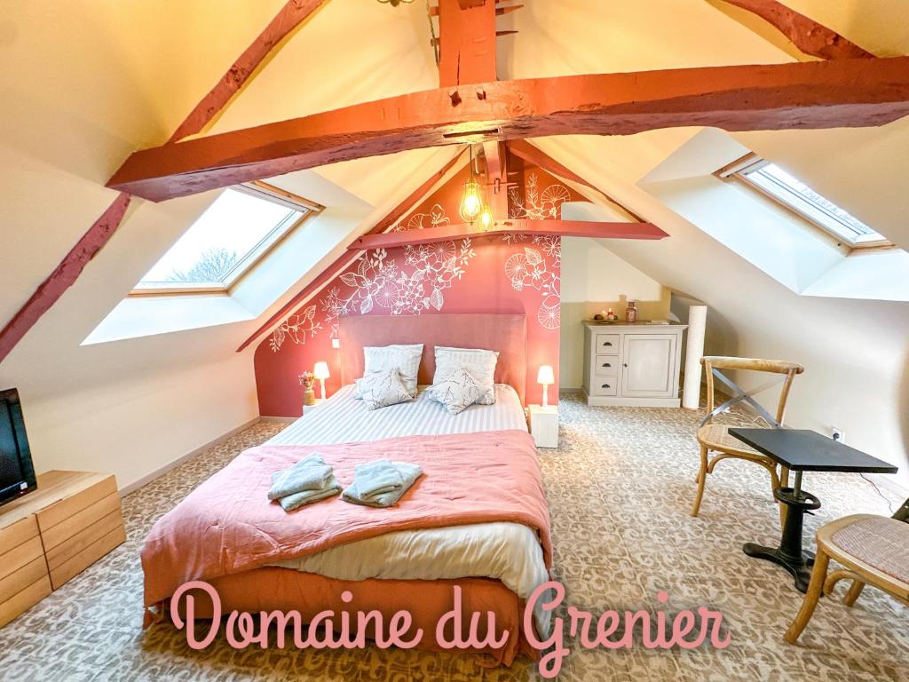 Postel nebo postele na pokoji v ubytování Domaine du Grenier