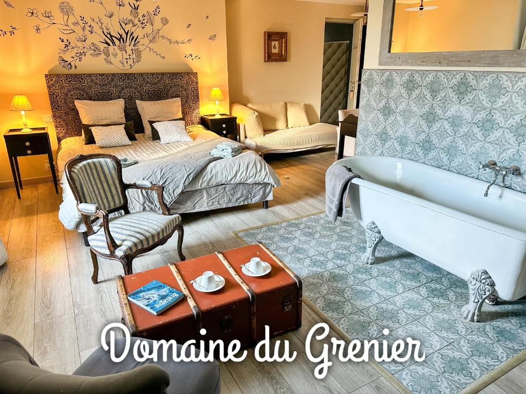 Postel nebo postele na pokoji v ubytování Domaine du Grenier