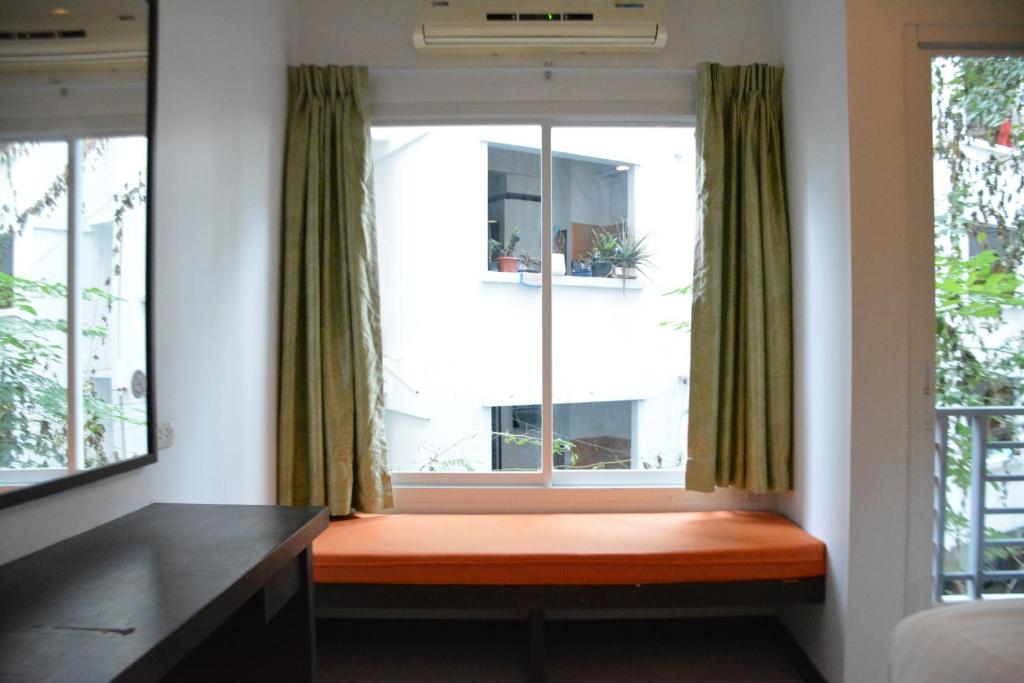 Postel nebo postele na pokoji v ubytování Zephyr Grand Hotel