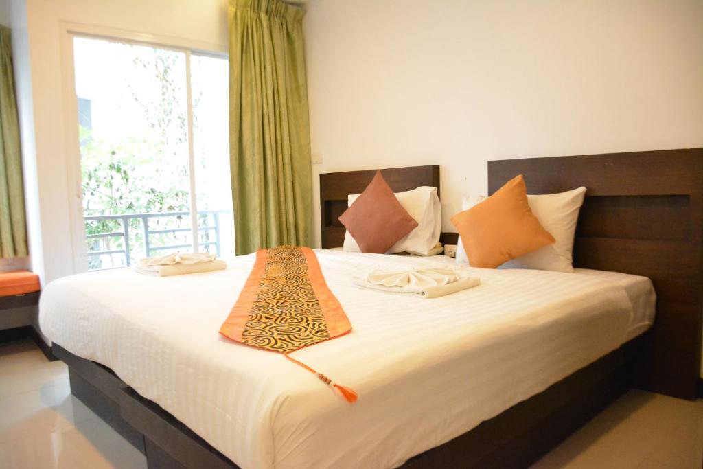 Postel nebo postele na pokoji v ubytování Zephyr Grand Hotel
