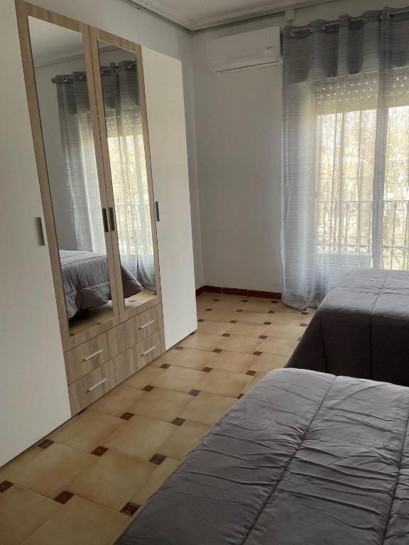 Postel nebo postele na pokoji v ubytování APARTAMENTOS LEONOR